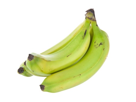 Banana bunch still green isolated on white backgroundの写真素材