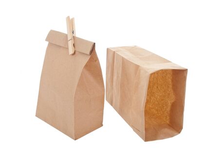 Old-fashied lunch bag with wooden clothes pin on white backgroundの写真素材
