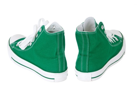 Vintage hanging green shoes on pure white backgroundの写真素材
