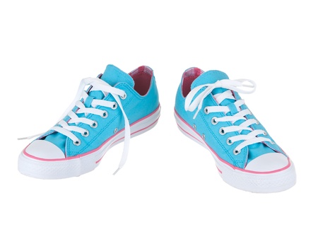 Vintage hanging blue shoes on pure white backgroundの写真素材