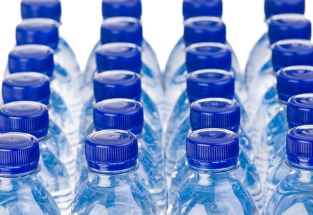 Rows of water bottles isolated on white backgroundの写真素材