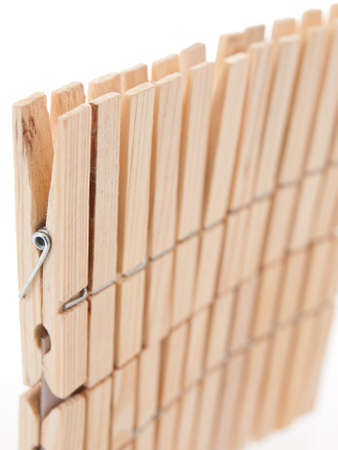 raw wood clothepin isolated on white backgroundの写真素材