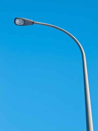 Streetlight isolated on blue skyの写真素材