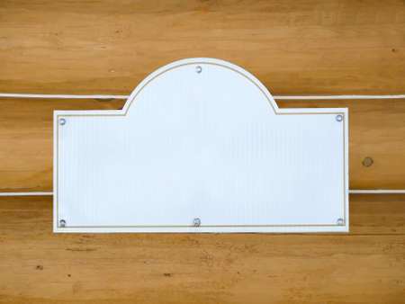 plastic blank sign on wood log backgroundの写真素材