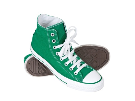 Vintage hanging green shoes on pure white backgroundの写真素材