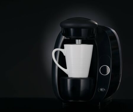 Modern coffee maker 3/4 view on black backgroundの写真素材