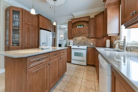 Contemporary kitchen with polyester cabinets in luxury homeの写真素材
