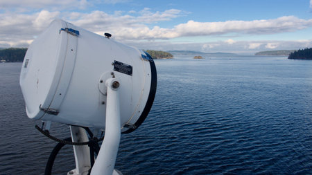 A search light aboard a BC Ferries vessel looks out over the water.の写真素材