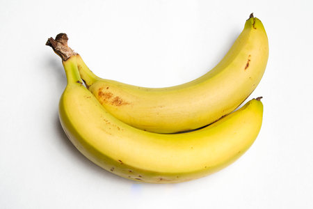 Two bananas are displayed on a white background.の写真素材