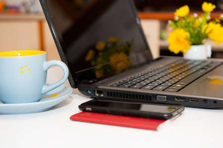 Passport, money and laptop on wooden table. Russian passport. Preparing for travelの写真素材