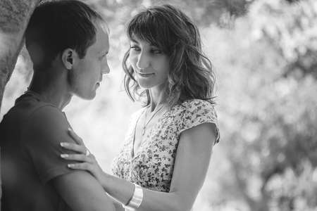 Happy couple on vacation. Lovers are laughing. Happy guy and girl. Lovers enjoy each other in the...