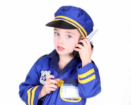 Young boy in police costume with hand radioの写真素材