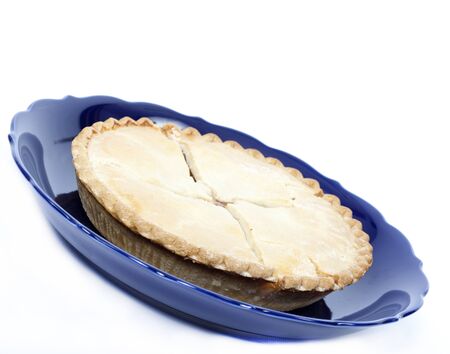 Apple pie in a dish isolated on whiteの写真素材