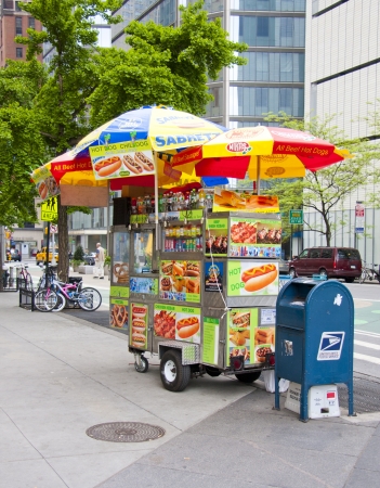 NEW YORK CITY USA-MAY 6 2012: Midtown, Hot dog vendors are a staple on the streets in New York City, May 6th, 2012 in Manhattan, New York City のeditorial素材
