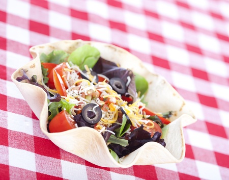 Taco salad on checkered tableclothの写真素材