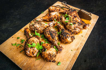 Grilled chicken legs with herbsの写真素材