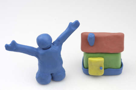 Happy Man made from Clay with Houseの写真素材