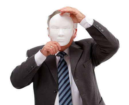 Business man covering his face with white maskの写真素材