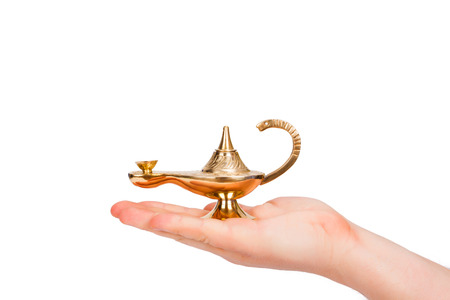 Aladdin lamp in human handの写真素材
