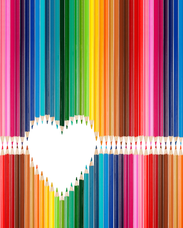 Colorful pencils set in middle of heart shape copy space in heartの写真素材