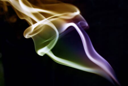 Beautiful colored abstract smoke on black backgroundの写真素材