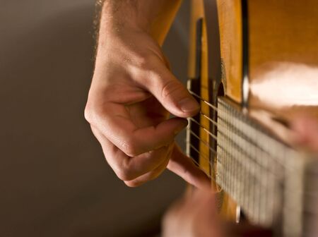 Musician playing classical acoustic guitar