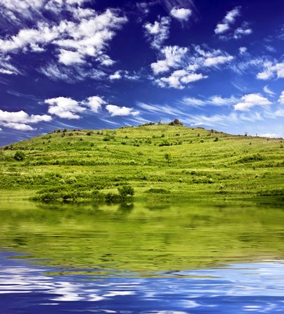 Blue sky and green fieldの写真素材