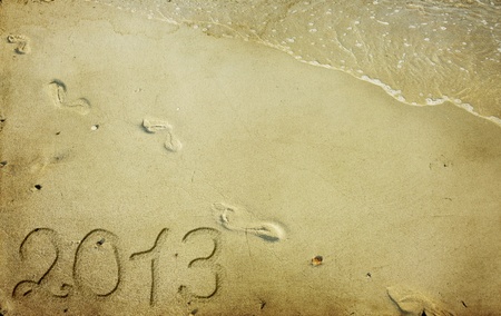 	New Year 2013 is coming - numbers written in sandの写真素材