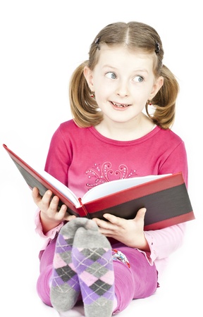 Little blonde girl readingの写真素材
