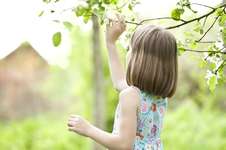 Beautiful blonde girl playing in the park の写真素材