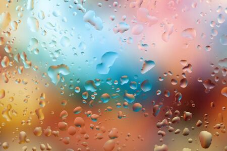 Fresh background of water drops on colorful surface