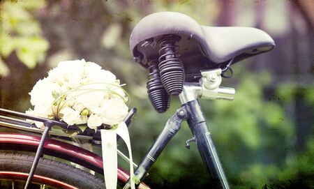 Vintage photo of wedding bouquet on a bicycle の写真素材