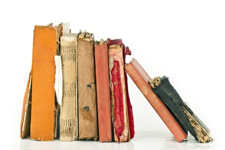 Pile of old books isolated on whiteの写真素材