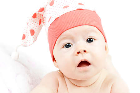 Portrait of adorable baby girl on with funny hatの写真素材