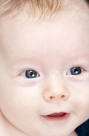 Closeup portrait of beautiful blue eyed baby girl の写真素材