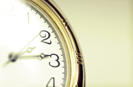 Close up on old styled gold pocket watch の写真素材