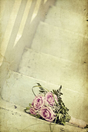 Vintage photo of pink wedding bouquet on the stairsの写真素材