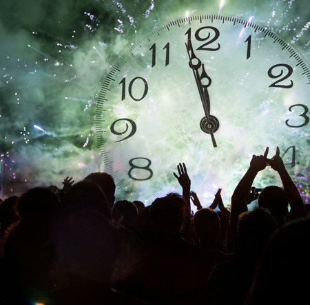 Clock close to midnight, fireworks and crowd waiting for New yearの写真素材
