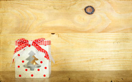 Christmas gift box on wooden backgroundの写真素材