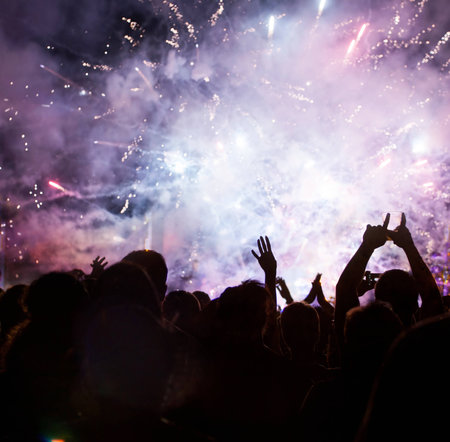 Fireworks and crowd celebrating the New yearの写真素材