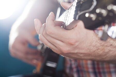 Guitarist on stage in the stagelight