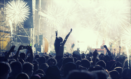 Cheering crowd and fireworks at New Year's Eve