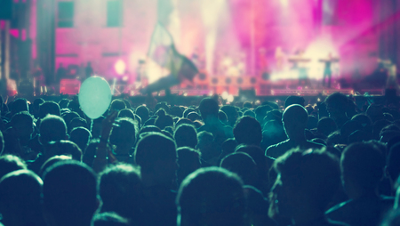 Crowd at concert and spectacular stage lightsの写真素材