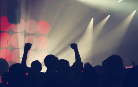 Crowd at concert and spectacular stage lightsの写真素材