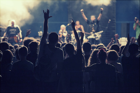 Crowd at concert and spectacular stage lights