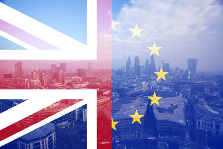 United Kingdom and European union flags combined, financial district in the background - UK votes to leave the EU, Brexit conceptの写真素材
