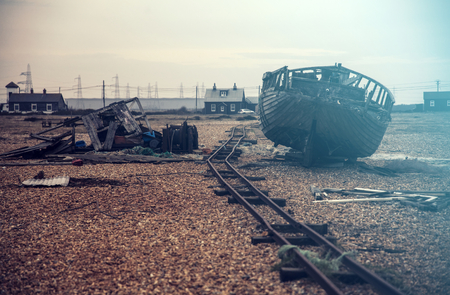 Old wooden fishing boat forgetten at Dungeness, Kent, England - retro styled photoの写真素材