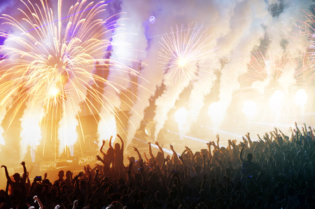 Colorful fireworks and crowd celebrating the New Yearの写真素材