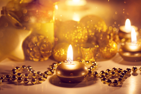 Gift box, candles and ornaments and beautiful Christmas lights - Holiday atmosphereの写真素材