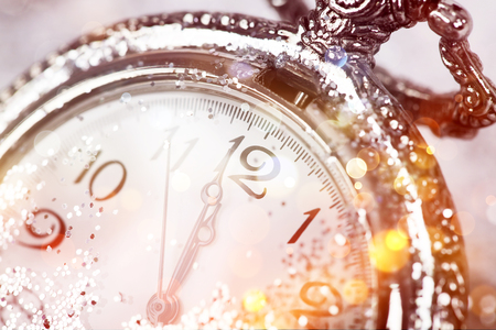 New Year's at midnight - Old clock with stars snowflakes and holiday lightsの写真素材